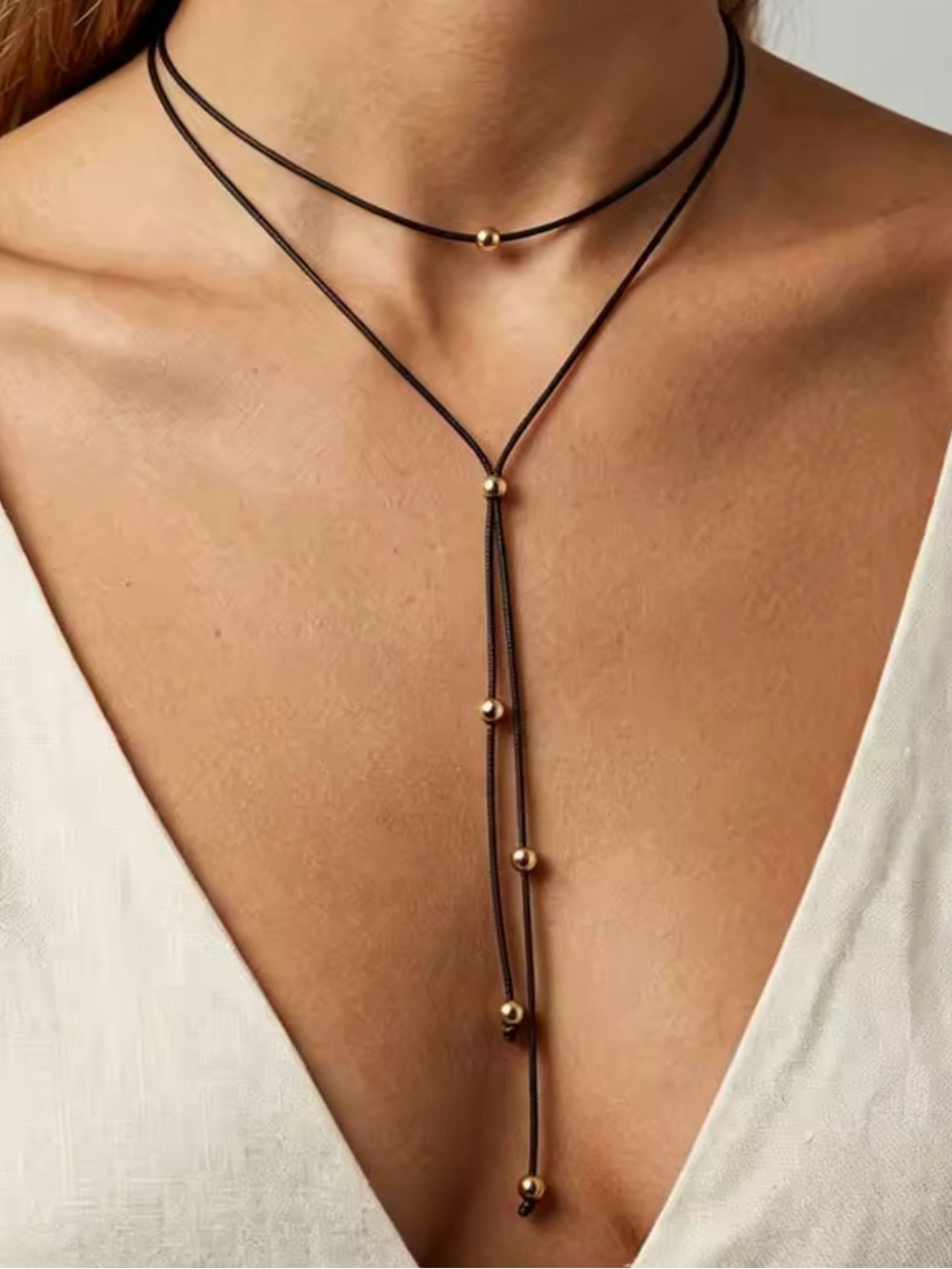 Delicate Black Rope Necklace with Gold Beads